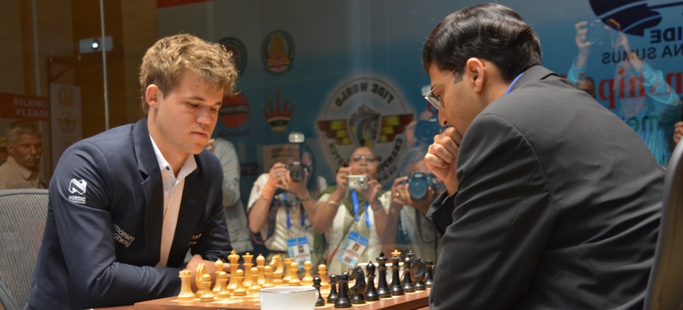Chess world champion Magnus Carlsen, of Norway, studies the board